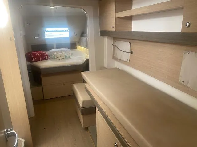 Slide: The Image of Interior of 2017 Bali 4.0 catamaran with modern kitchen and dining area. - 16