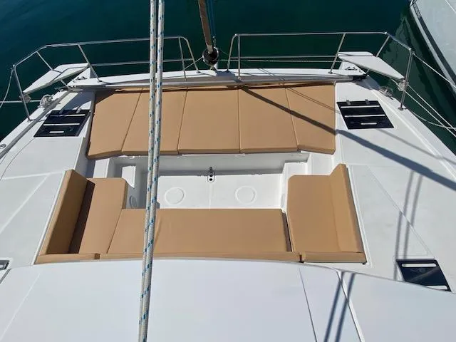 Slide: The Image of 2017 Bali 4.0 catamaran docked, featuring helm station and sunbathing area. - 7