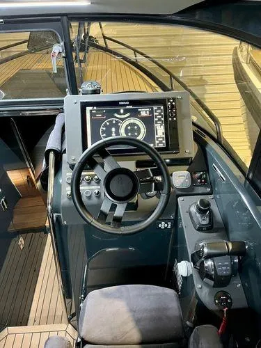 Slide: The Image of 2024 XO Boats EXPLR 10S cockpit with advanced navigation system and controls. - 4
