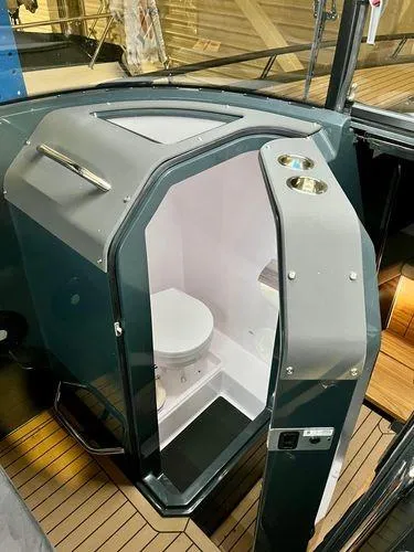 Slide: The Image of 2024 XO Boats EXPLR 10S interior cabin with toilet. - 3