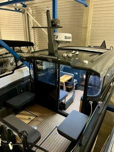 Slide: The Image of 2024 XO Boats EXPLR 10S interior with seating and navigation equipment. - 7