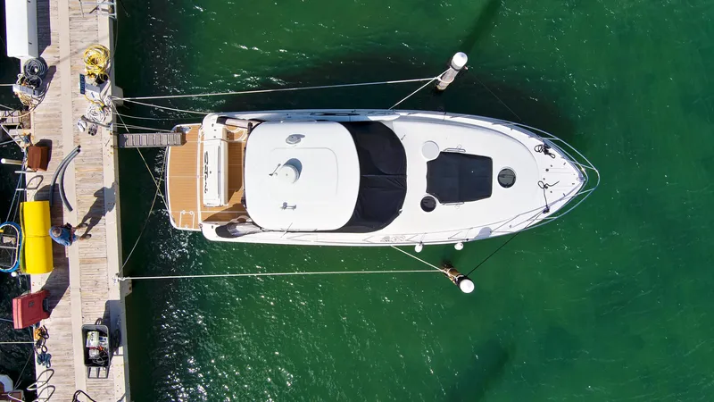 Slide: The Image of Aerial view of a 2006 Regal 3560 Commodore yacht docked at a marina. - 5