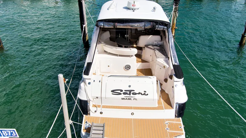 Slide: The Image of 2006 Regal 3560 Commodore yacht docked in marina, rear view. - 8