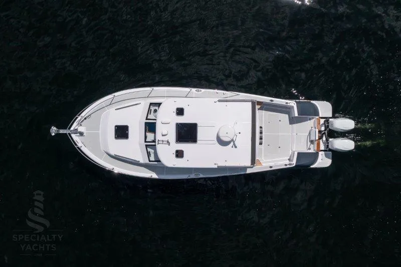 Slide: The Image of Aerial view of 2024 True North 34 yacht on dark water. - 11