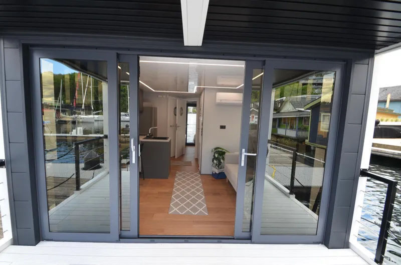 Slide: The Image of Modern houseboat interior with glass doors, La Mare Modern 11, 2024 model. - 6