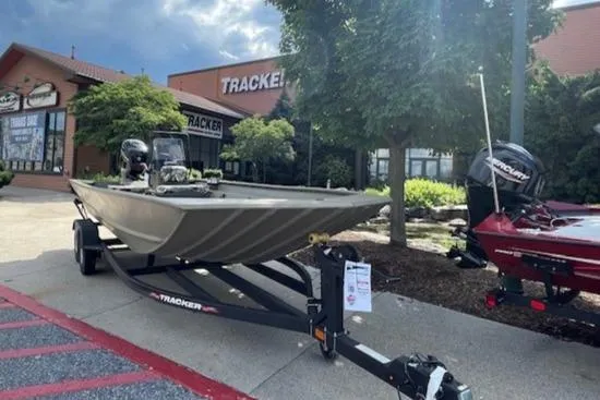 Slide: The Image of 2024 Tracker Grizzly 2072 CC boat on trailer outside dealership. - 3