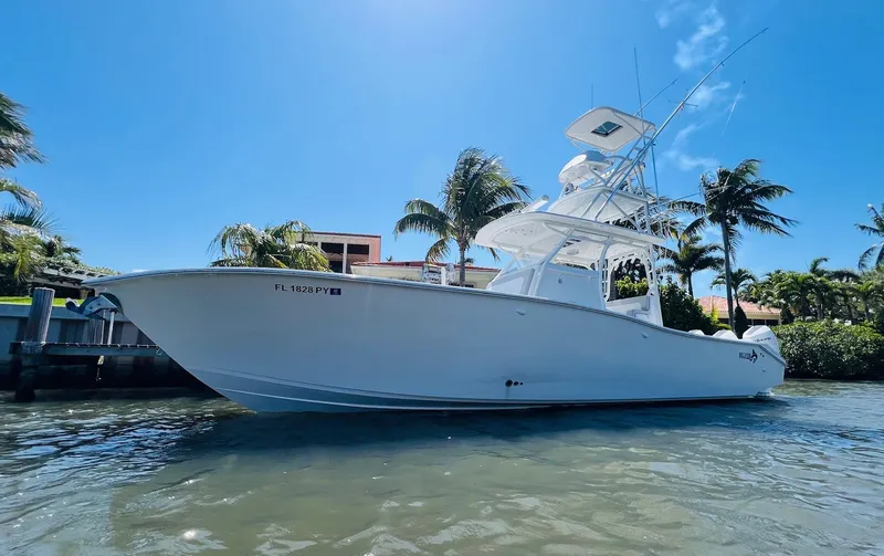 Slide: The Image of 2015 Billfish 39 Custom CC boat docked in sunny waterfront location. - 1