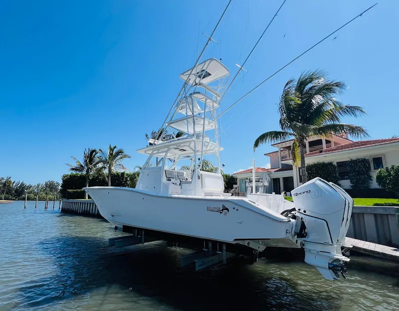 Slide: The Image of 2015 Billfish 39 Custom CC boat docked near waterfront home. - 10