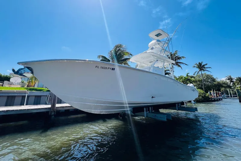 Slide: The Image of 2015 Billfish 39 Custom CC boat docked by the water on a sunny day. - 12