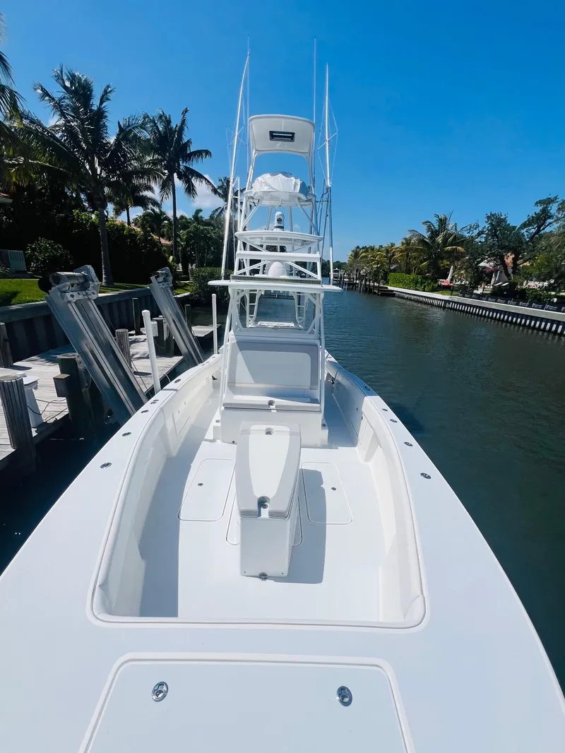 Slide: The Image of 2015 Billfish 39 Custom CC boat docked in a sunny canal. - 18