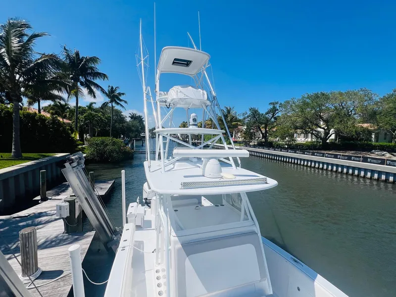 Slide: The Image of 2015 Billfish 39 Custom CC boat docked in a sunny canal. - 21