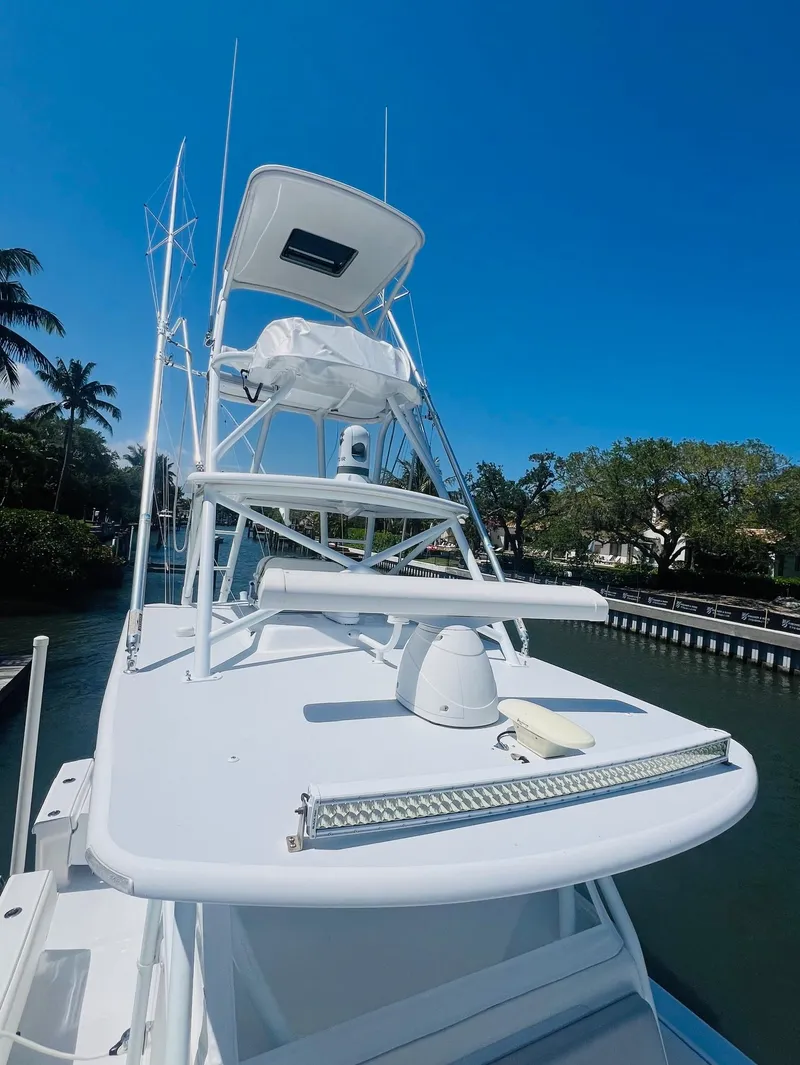 Slide: The Image of 2015 Billfish 39 Custom CC boat with tower and clear blue sky. - 23