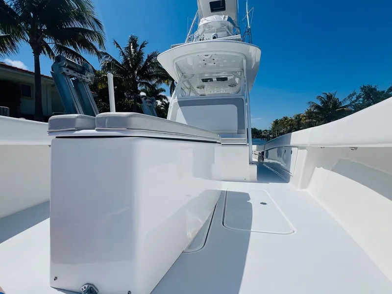 Slide: The Image of 2015 Billfish 39 Custom CC boat with sleek white deck and modern design. - 26