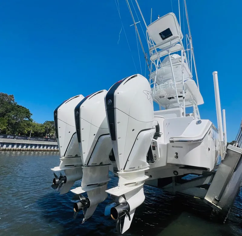 Slide: The Image of 2015 Billfish 39 Custom CC with triple outboard engines on water. - 36