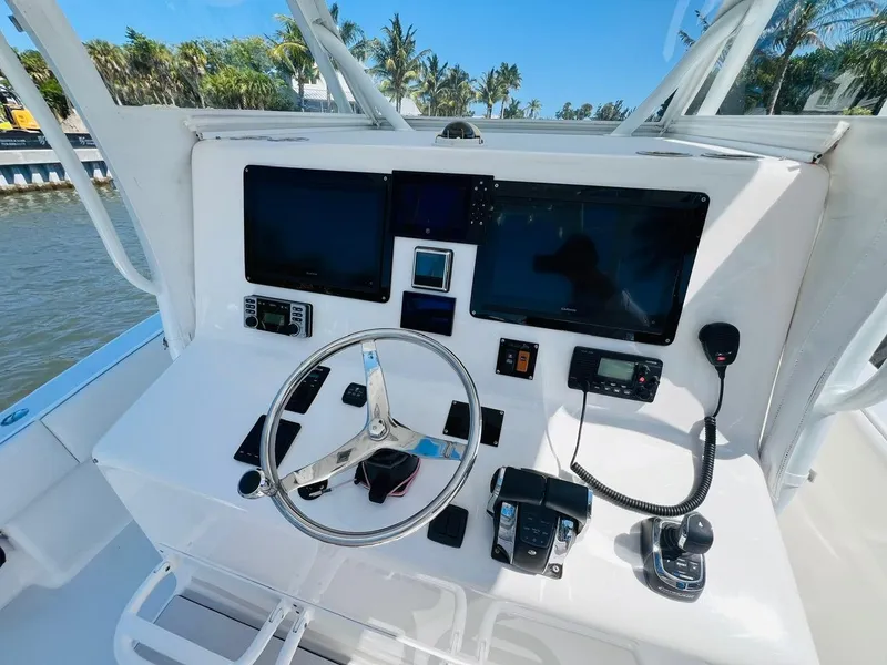 Slide: The Image of 2015 Billfish 39 Custom CC helm with dual screens and navigation controls. - 49