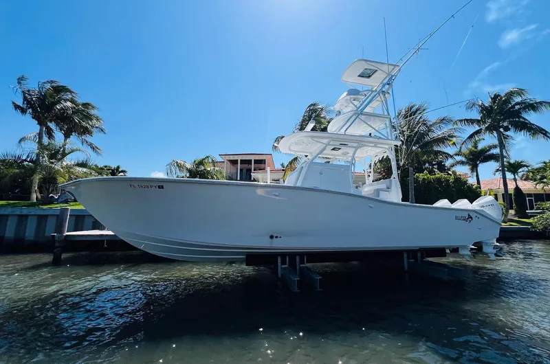 Slide: The Image of 2015 Billfish 39 Custom CC boat docked near palm trees. - 5