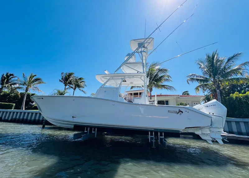 Slide: The Image of 2015 Billfish 39 Custom CC boat docked near palm trees. - 6