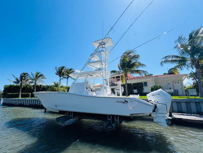 Slide: The Image of 2015 Billfish 39 Custom CC boat docked near waterfront homes. - 7
