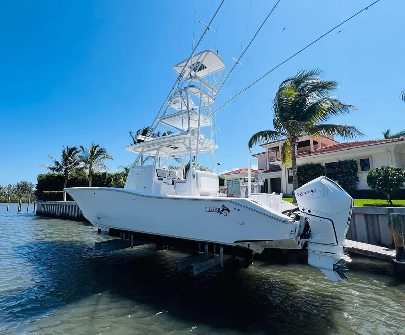 Slide: The Image of 2015 Billfish 39 Custom CC boat docked near waterfront property. - 8