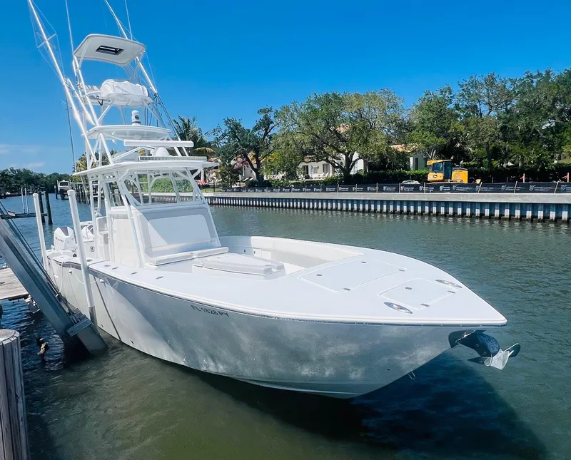 Slide: The Image of 2015 Billfish 39 Custom CC boat docked by a riverside. - 9