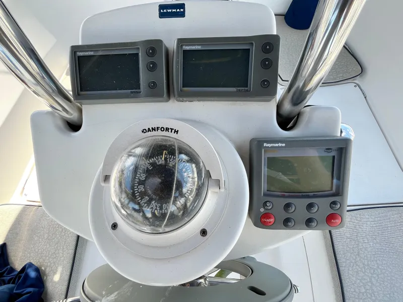 Slide: The Image of Helm of 2005 Hunter 31 sailboat with navigation instruments and compass. - 11