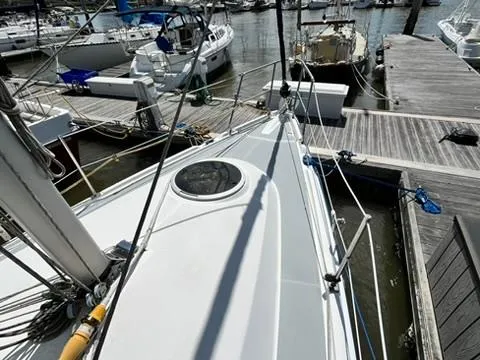 Slide: The Image of 2005 Hunter 31 sailboat docked at marina, view from deck. - 3