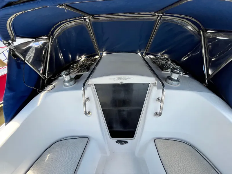 Slide: The Image of 2005 Hunter 31 sailboat cockpit with blue canopy and stainless steel fittings. - 6
