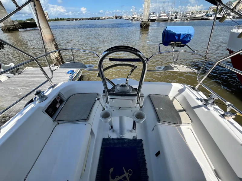 Slide: The Image of Cockpit of 2005 Hunter 31 sailboat docked by the water. - 9