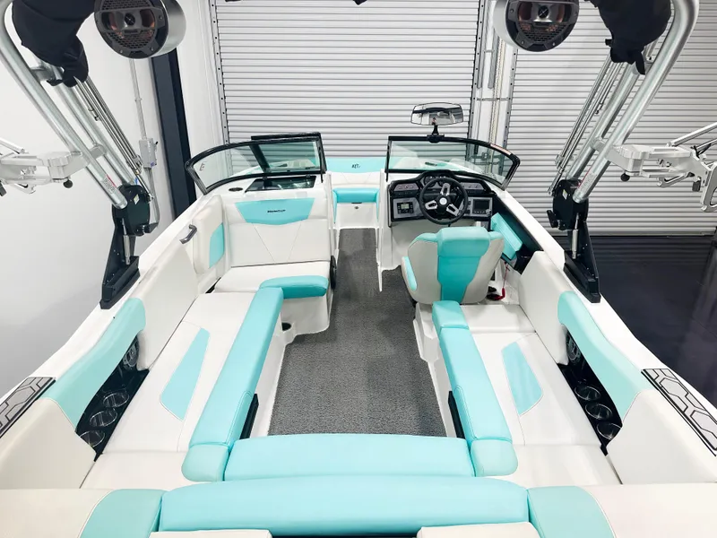 Slide: The Image of 2020 MasterCraft NXT 22 boat interior with turquoise and white seating. - 4