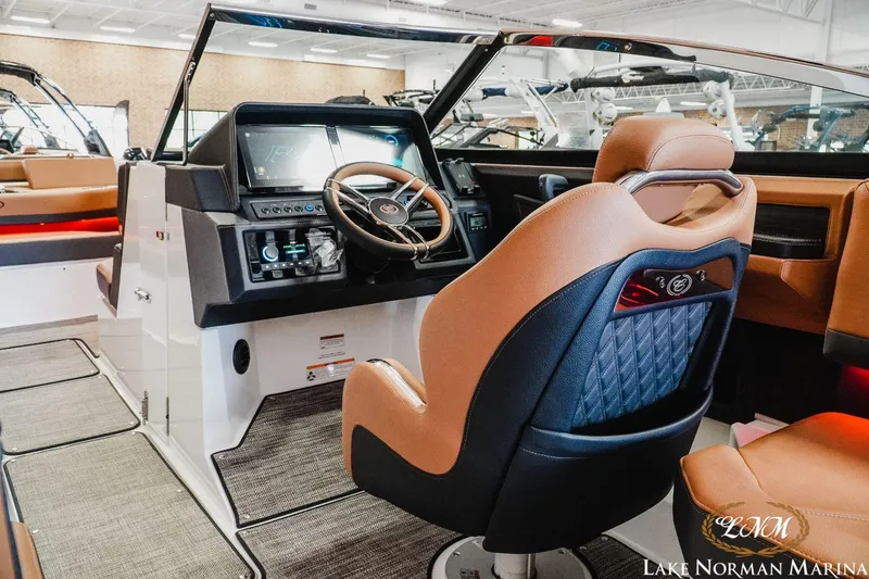 Slide: The Image of 2023 Cobalt R8 boat interior with modern dashboard and leather seating at Lake Norman Marina. - 10