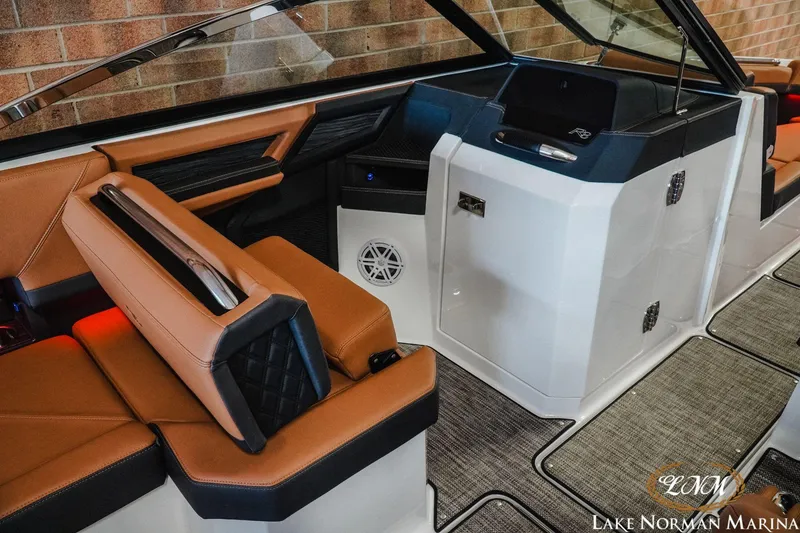 Slide: The Image of 2023 Cobalt R8 boat interior with tan leather seats and modern dashboard. - 12