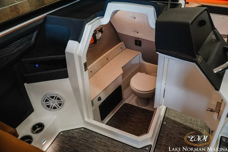 Slide: The Image of 2023 Cobalt R8 boat interior with a compact bathroom at Lake Norman Marina. - 13