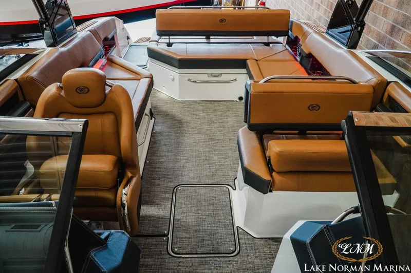 Slide: The Image of 2023 Cobalt R8 boat interior with luxurious tan leather seating at Lake Norman Marina. - 16