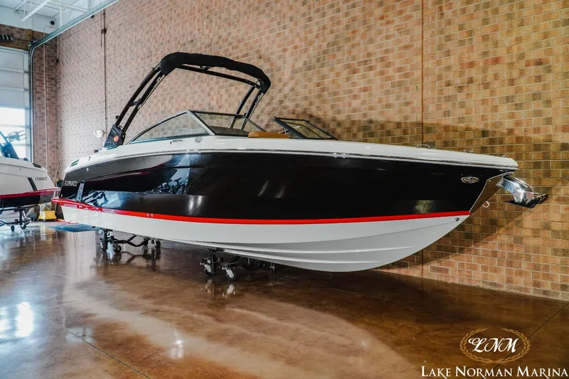 Slide: The Image of 2023 Cobalt R8 boat displayed at Lake Norman Marina. - 2