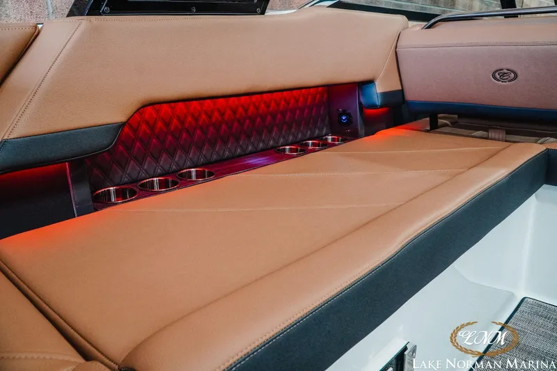 Slide: The Image of Luxurious interior of 2023 Cobalt R8 boat with red ambient lighting. - 20