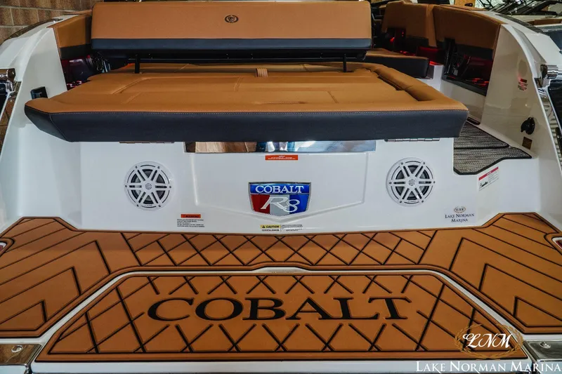 Slide: The Image of 2023 Cobalt R8 boat rear view with logo and seating at Lake Norman Marina. - 6