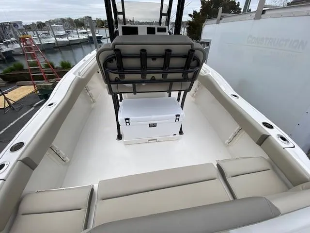 Slide: The Image of 2024 Key West 219 FS boat interior with seating and cooler. - 10