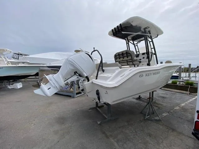 Slide: The Image of 2024 Key West 219 FS boat on a stand, rear view. - 2