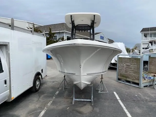 Slide: The Image of 2024 Key West 219 FS boat on stands in a marina parking lot. - 3