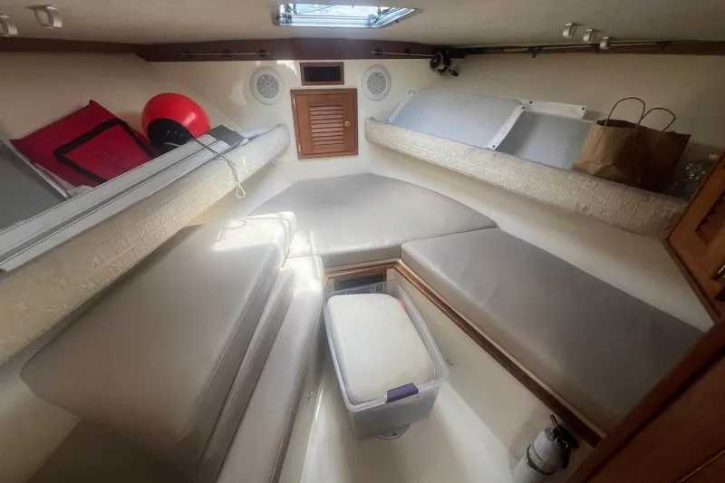 Slide: The Image of Interior cabin of 2002 Albemarle 285 Express Fisherman boat with seating and storage. - 13