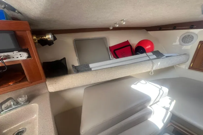 Slide: The Image of Interior of 2002 Albemarle 285 Express Fisherman boat with seating and storage. - 15