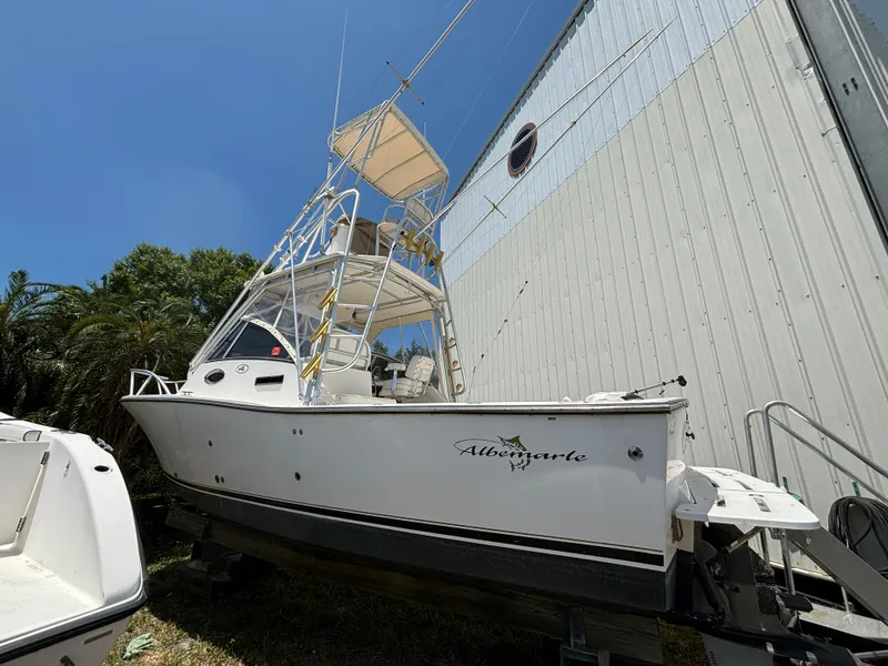 Slide: The Image of 2002 Albemarle 285 Express Fisherman boat docked near a building. - 19