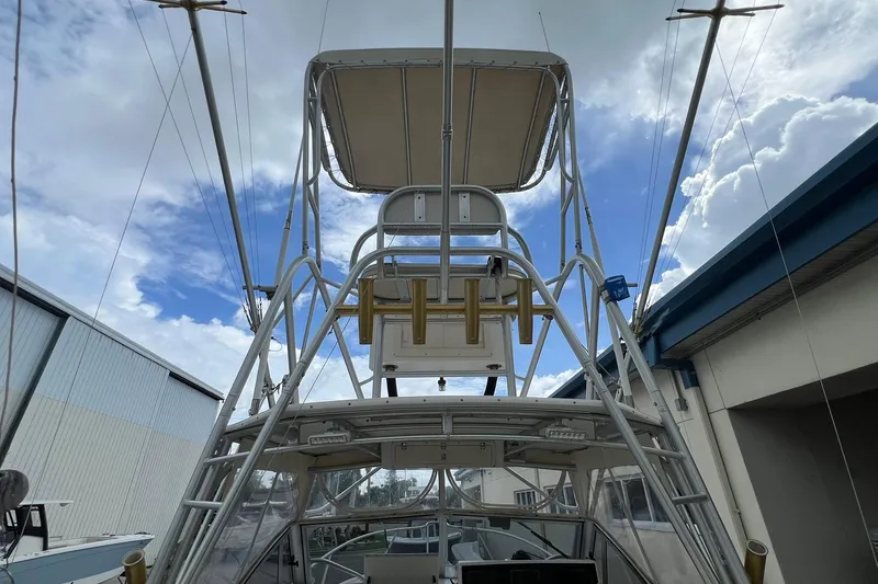 Slide: The Image of 2002 Albemarle 285 Express Fisherman boat with tower against a cloudy sky. - 21