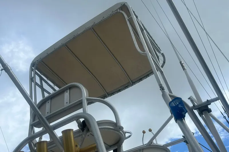 Slide: The Image of Albemarle 285 Express Fisherman 2002 boat tower against cloudy sky. - 22