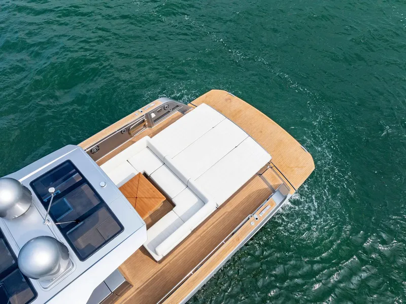Slide: The Image of 2023 Pardo Yachts 50 model, aerial view of luxurious deck and seating area. - 13