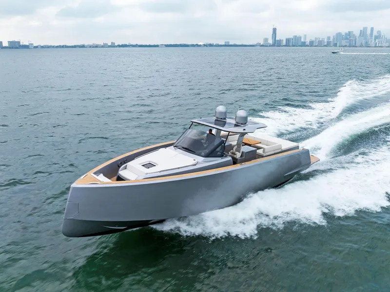 Slide: The Image of 2023 Pardo Yachts 50 cruising on open water near city skyline. - 17