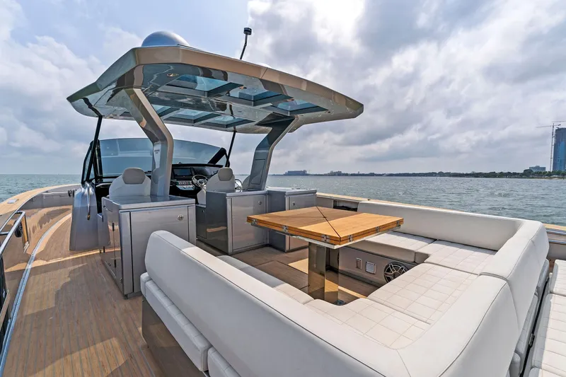 Slide: The Image of 2023 Pardo Yachts 50 with spacious deck and seating area on the water. - 32