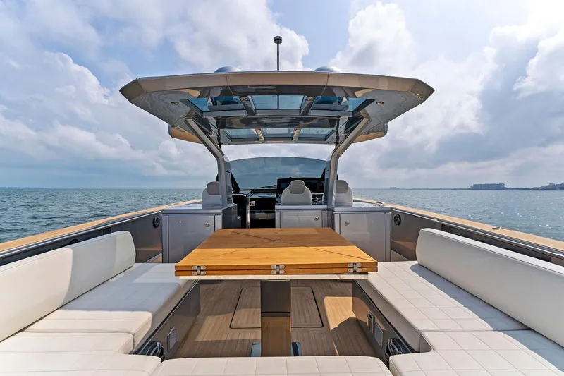 Slide: The Image of 2023 Pardo Yachts 50 with spacious deck and luxurious seating on open water. - 35