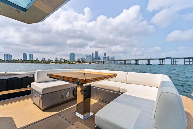 Slide: The Image of Luxury seating area on 2023 Pardo Yachts 50 with city skyline view. - 36
