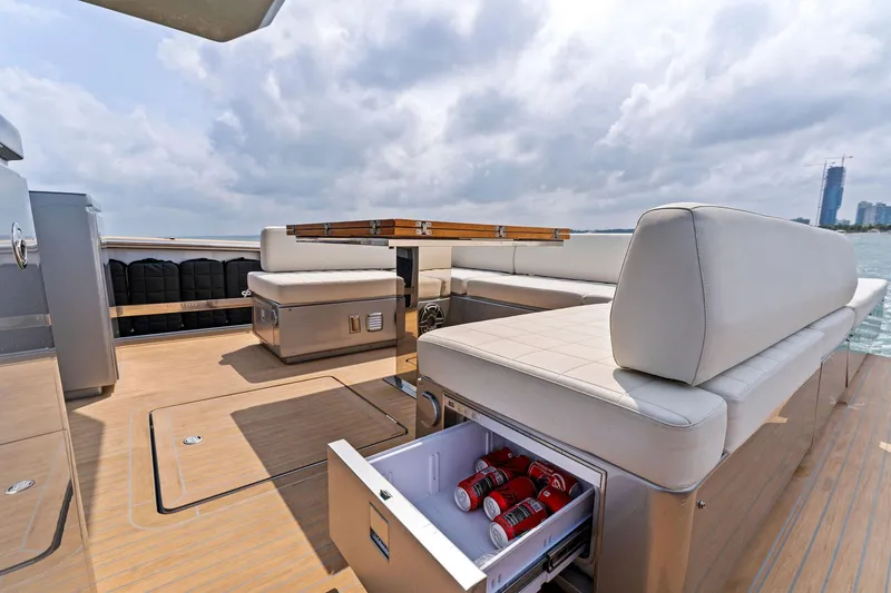 Slide: The Image of 2023 Pardo Yachts 50 deck with seating and built-in cooler. - 37